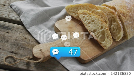 Displaying sliced ciabatta loaf on wooden board with handle and twine, speech bubbles showing 47 Displaying sliced ciabatta loaf on wooden board with handle and twine, speech bubbles showing 47 142186820