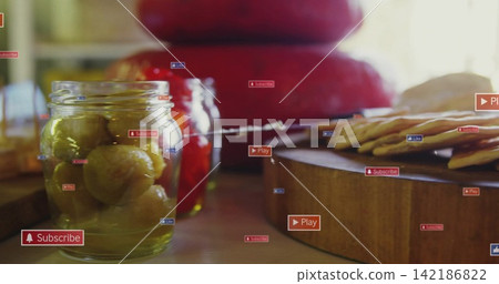 Showing glass jar green pickles on home counter, crackers cheeses red pickles UI labels, copy space Showing glass jar green pickles on home counter, crackers cheeses red pickles UI labels, copy space 142186822