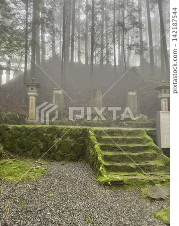 The shrine's approach is shrouded in mist. The shrine's approach is shrouded in mist. 142187544