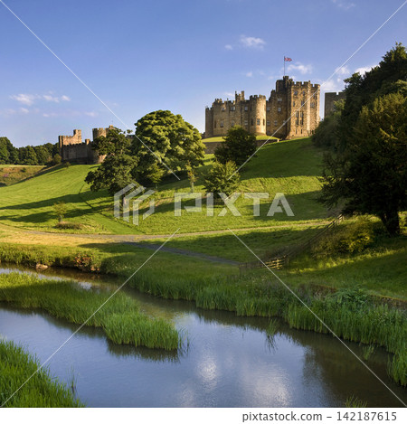 Alnwick Castle in Northumberland in northeast England Alnwick Castle in Northumberland in northeast England 142187615