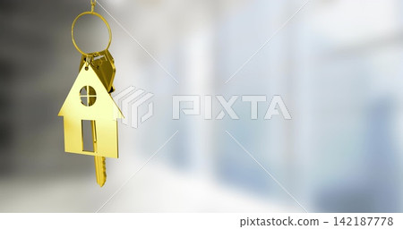 Hanging gold house-shaped keychain pendant and metal keys near left in bright interior, copy space Hanging gold house-shaped keychain pendant and metal keys near left in bright interior, copy space 142187778