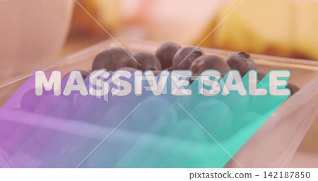Displaying clear plastic clamshell with blueberries at shop shelf, showing MASSIVE SALE overlay Displaying clear plastic clamshell with blueberries at shop shelf, showing MASSIVE SALE overlay 142187850