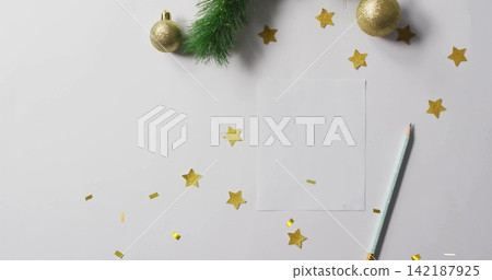 Framing blank card sitting right on tabletop, with gold confetti and mint-green pencil, copy space Framing blank card sitting right on tabletop, with gold confetti and mint-green pencil, copy space 142187925