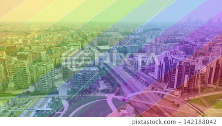 Capturing aerial cityscape spanning urban district, showing highway overpass, park, rainbow overlay Capturing aerial cityscape spanning urban district, showing highway overpass, park, rainbow overlay 142188042