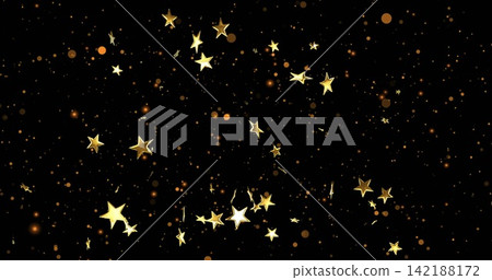 Glittering gold five-pointed stars curving on deep black backdrop, showing amber bokeh and sparkles 142188172