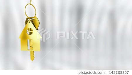 Hanging gold house keychain showing round window with brass key, hexagon tag at left, copy space Hanging gold house keychain showing round window with brass key, hexagon tag at left, copy space 142188207