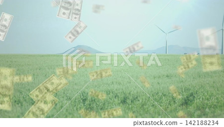 Wind blowing through crops, sending faint dollar bills past turbines, showing farm finance 142188234