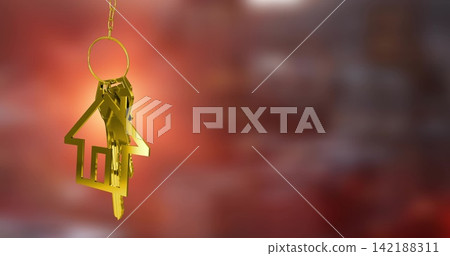 Hanging gold key set on chain glinting in warm light, with house key fob, copy space Hanging gold key set on chain glinting in warm light, with house key fob, copy space 142188311
