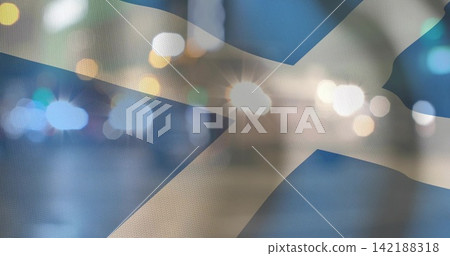 Displaying Saltire flag showing woven texture at night, with bokeh lights and lens flares 142188318