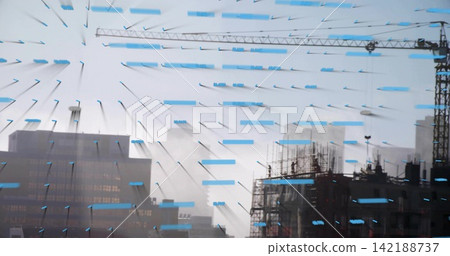 Framing urban construction site with tower crane and scaffolding, glass pane showing blue tape Framing urban construction site with tower crane and scaffolding, glass pane showing blue tape 142188737