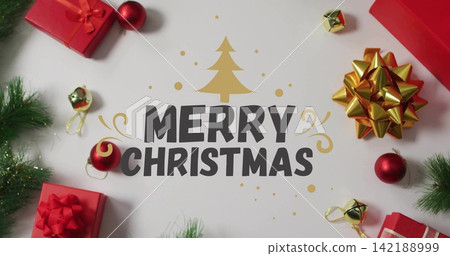 Framing MERRY CHRISTMAS with gold tree, red gifts, gold bow, baubles, bells, pine on white paper 142188999
