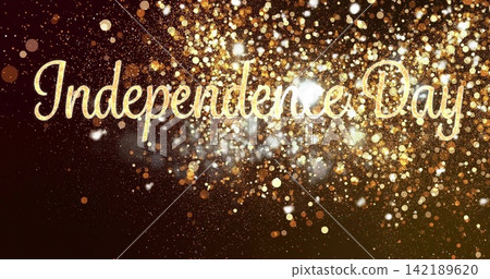 Displaying gold cursive Independence Day text across digital banner, with gold bokeh glitter flares 142189620