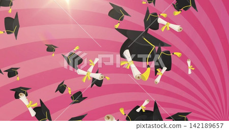 Tossing black caps yellow-tasseled and scrolls yellow-ribboned across pink stripes, bright flare Tossing black caps yellow-tasseled and scrolls yellow-ribboned across pink stripes, bright flare 142189657