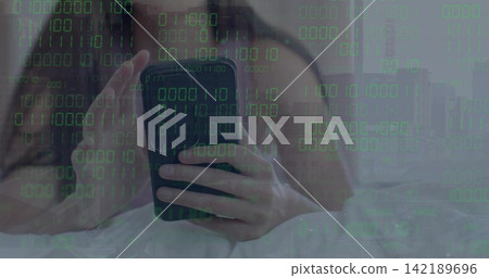 Vertical video: Holding dark-case phone, woman in bed bare shoulders scrolling under binary overlay Vertical video: Holding dark-case phone, woman in bed bare shoulders scrolling under binary overlay 142189696