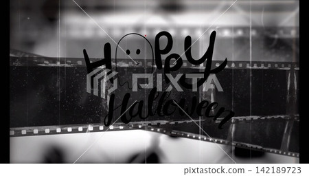 Displaying hand-drawn Happy Halloween and ghost doodle on flatbed scanner, showing sprocket holes Displaying hand-drawn Happy Halloween and ghost doodle on flatbed scanner, showing sprocket holes 142189723