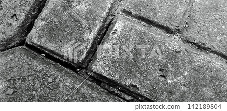 Black and white concrete paving block texture 142189804