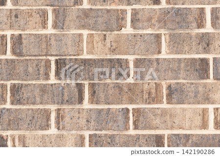 Textured brown backdrop. Wall texture background. Brick wall structure. Brick masonry background. Building material concept. Surface of brickwall. Vintage brick backdrop Textured brown backdrop. Wall texture background. Brick wall structure. Brick masonry background. Building material concept. Surface of brickwall. Vintage brick backdrop 142190286