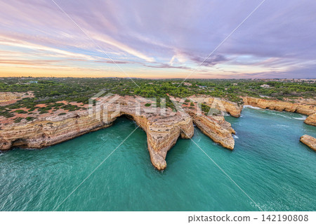 Drone Sunset View of Arco de Albandeira With Pink Evening Clouds Drone Sunset View of Arco de Albandeira With Pink Evening Clouds 142190808