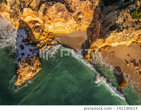 Praia da Marinha beach overhead ocean cliffs and sea stacks Algarve Portugal Praia da Marinha beach overhead ocean cliffs and sea stacks Algarve Portugal 142190814