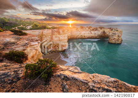 Arco de Albandeira sunrise Praia de Albandeira beach ocean Algarve Portugal Arco de Albandeira sunrise Praia de Albandeira beach ocean Algarve Portugal 142190817