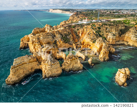 Ocean cliffs and sea stacks at Ponte da Piedade in Lagos Algarve Portugal Ocean cliffs and sea stacks at Ponte da Piedade in Lagos Algarve Portugal 142190821