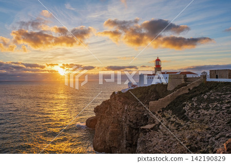 Cabo de Sao Vicente lighthouse at sunset above a rocky headland Cabo de Sao Vicente lighthouse at sunset above a rocky headland 142190829