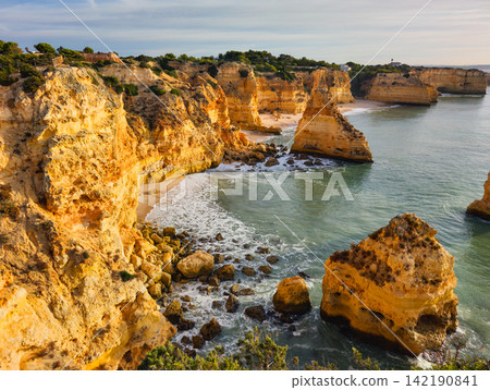 Sunrise View of Praia da Marinha Cliffs and Sea Stacks Sunrise View of Praia da Marinha Cliffs and Sea Stacks 142190841