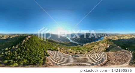 Douro River sunrise panorama over terraced vineyards in Douro Valley Douro River sunrise panorama over terraced vineyards in Douro Valley 142190886
