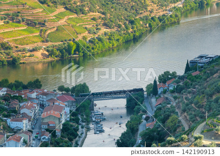 Douro Train on River Bridge in Regua Portugal Douro Train on River Bridge in Regua Portugal 142190913
