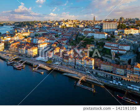 Drone view of Ribeira in Porto with rabelo boats at sunrise Drone view of Ribeira in Porto with rabelo boats at sunrise 142191103