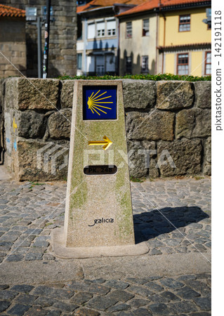Caminho de Santiago sign and yellow arrow on Porto street Caminho de Santiago sign and yellow arrow on Porto street 142191118