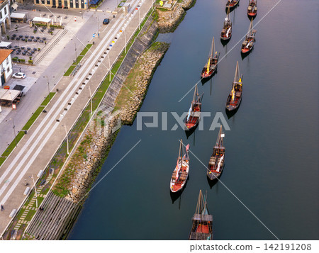 Drone top down view of rabelo boats on the Douro River Drone top down view of rabelo boats on the Douro River 142191208