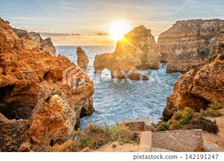 Sunrise sea arch and cliffs at Ponte da Piedade in Lagos, Portugal Sunrise sea arch and cliffs at Ponte da Piedade in Lagos, Portugal 142191247