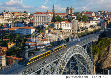 Porto sunrise tram on Luis I Bridge above Douro River from Serra do Pilar Porto sunrise tram on Luis I Bridge above Douro River from Serra do Pilar 142191322