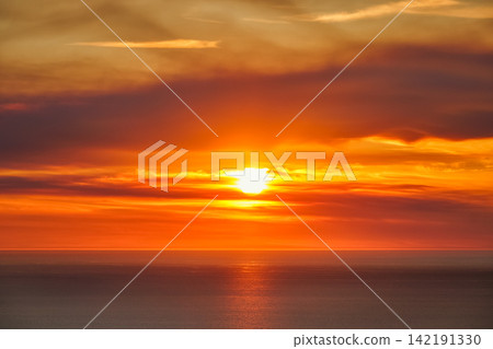 Orange Atlantic sunset with layered clouds in Portugal 142191330