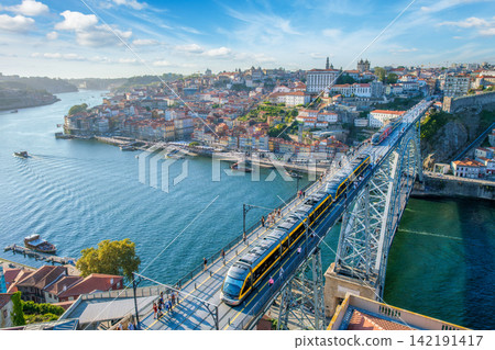 Wide Porto tram and tourist boats by Luis I Bridge on Douro River Wide Porto tram and tourist boats by Luis I Bridge on Douro River 142191417