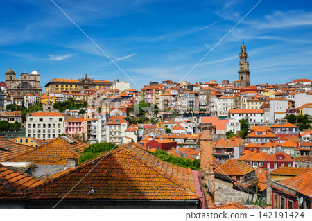 Wide Porto cityscape with Clerigos Tower and red rooftops Wide Porto cityscape with Clerigos Tower and red rooftops 142191424