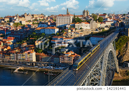 Porto tram and river boats by Luis I Bridge over Douro River Porto tram and river boats by Luis I Bridge over Douro River 142191441