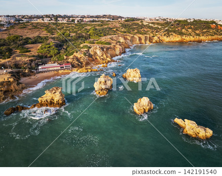 Drone View of Praia dos Arrifes Shoreline and Sea Stacks Drone View of Praia dos Arrifes Shoreline and Sea Stacks 142191540