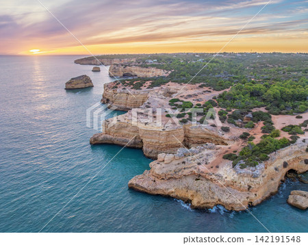 Drone Sunset View of Arco de Albandeira Along Rugged Coastline Drone Sunset View of Arco de Albandeira Along Rugged Coastline 142191548