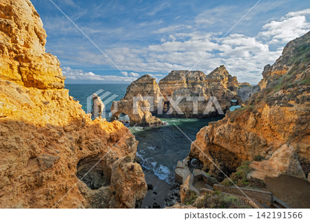 Ponte da Piedade ocean cliff and sea stack, Lagos Algarve Portugal with sand 142191566