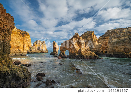 Ponte da Piedade sea stack and ocean cliff, Lagos Algarve Portugal with rocks Ponte da Piedade sea stack and ocean cliff, Lagos Algarve Portugal with rocks 142191567