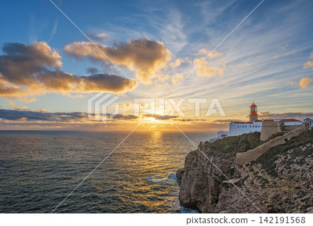 Cabo de Sao Vicente lighthouse at sunset with Atlantic surf in Sagres Cabo de Sao Vicente lighthouse at sunset with Atlantic surf in Sagres 142191568