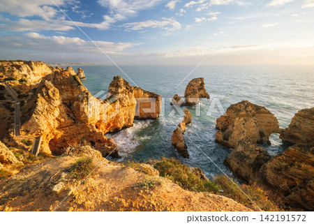 Ponte da Piedade cliffs in golden sunrise light in Lagos, Portugal Ponte da Piedade cliffs in golden sunrise light in Lagos, Portugal 142191572