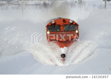 A snow-clearing train clearing snow from the Soya Main Line A snow-clearing train clearing snow from the Soya Main Line 142191657