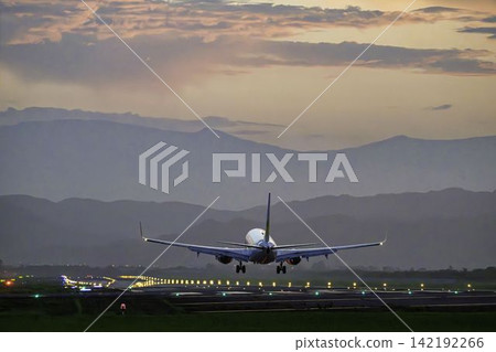Sendai Airport at dusk, a plane landing, from view #27, Natori City, Miyagi Prefecture. 142192266