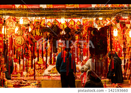 The shops on Dihua Street are filled with red New Year decorations. The shops on Dihua Street are filled with red New Year decorations. 142193660
