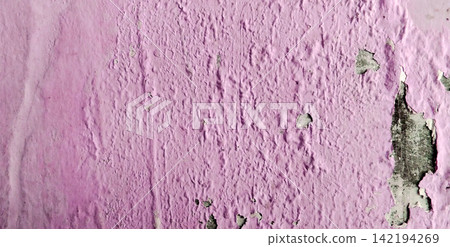Peeling pink paint texture on a weathered concrete wall Peeling pink paint texture on a weathered concrete wall 142194269