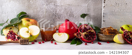 Rosh Hashana concept with honey, apple and pomegranate Rosh Hashana concept with honey, apple and pomegranate 142194307