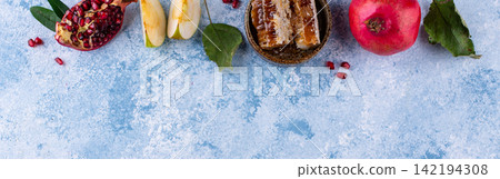Rosh Hashana concept with honey, apple and pomegranate Rosh Hashana concept with honey, apple and pomegranate 142194308